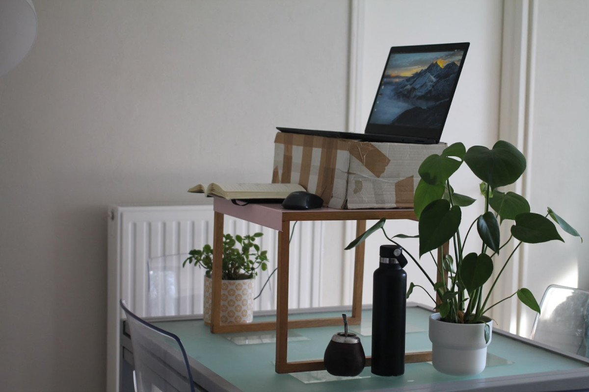 My work set up: makeshift standing desk, notebook, and maté